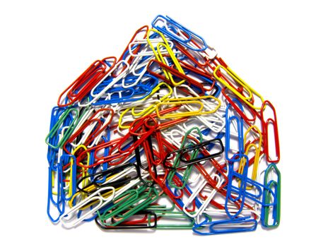 Multicolored paperclips layed out in the shape of a house