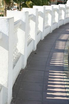 white decorative wall with long shadows