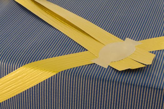 Closeup of Present and golden ribbon with copyspace