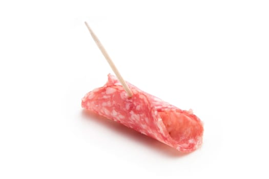 Slice of salami on a toothpick