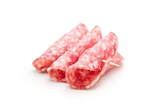 Slices of salami on a toothpick