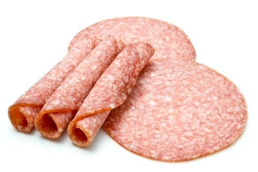 Slices of salami isolated over white background