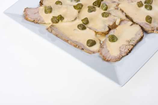 detail of vitello tonnato on a plate