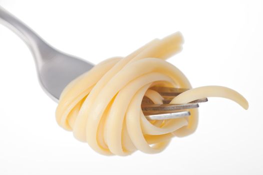 spaghetti on a fork on white background