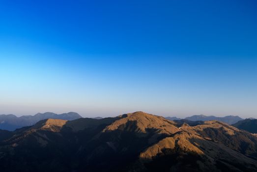 It is the golden mountain with blue sky.