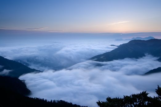 It is beautiful mountain landscape full of clouds.