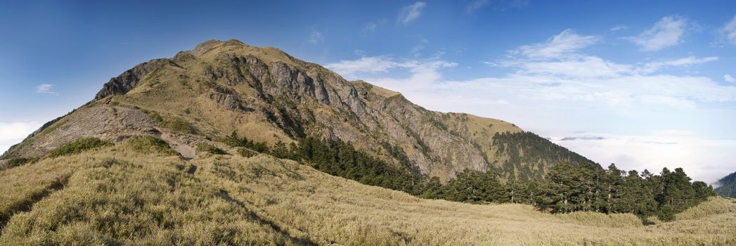 It is beautiful panorama mountain landscape with blue sky.