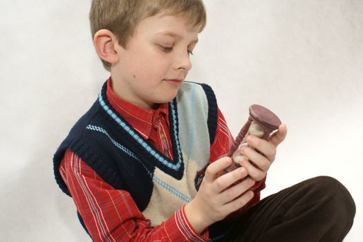 Young boy with old sandglass