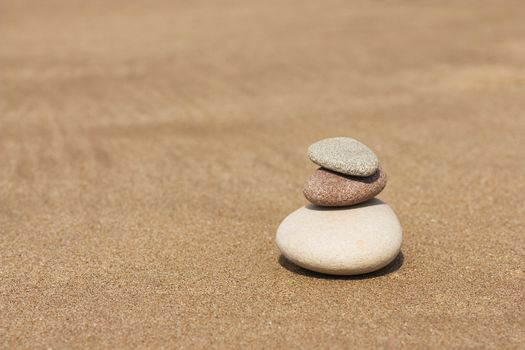 three stones on the sand