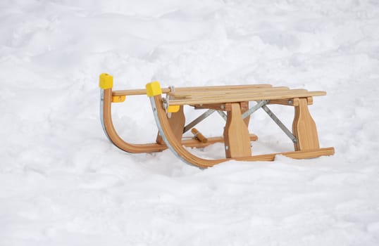 Old fashioned wooden sledge in the snow.