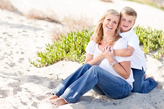 Cute Son Hugs His Attractive Mom Portrait at The Beach.