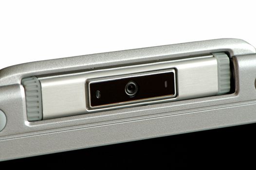 Close up of laptop computer's video cam over white