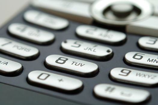 A close up shot of mobile keypad under light