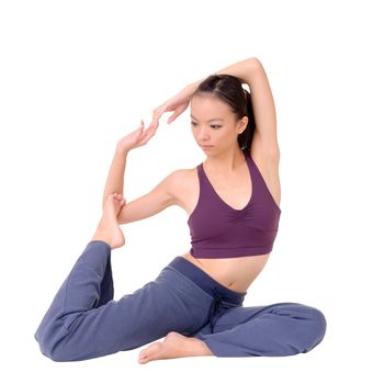 Young Asian woman doing expert yoga exercise isolated over white.