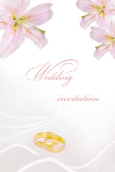 wedding invitation or greeting card blank with lily flowers and golden rings