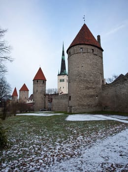 Ancient stone walls of Tallinn with four towers in alignment