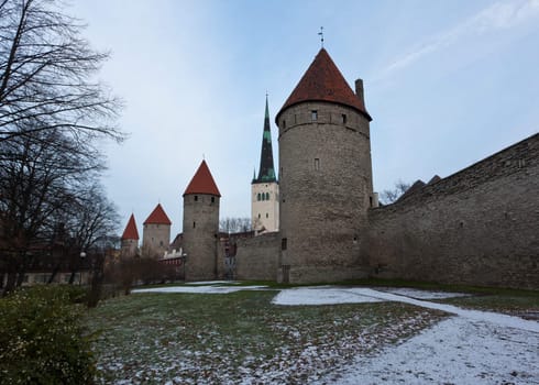 Ancient stone walls of Tallinn with four towers in alignment