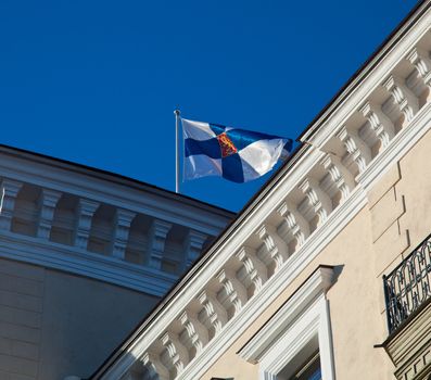 Estonian flag flies over the old buildings of Tallinn in the Toompea district