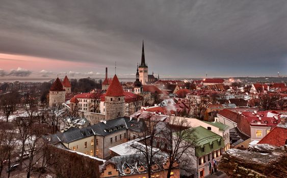 Overview of Tallinn in Estonia taken from the overlook in Toompea showing the town walls and churches. Taken in HDR to enhance the sunset