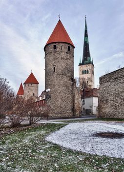 Ancient stone walls of Tallinn with four towers in alignment taken in HDR to get extra clarity
