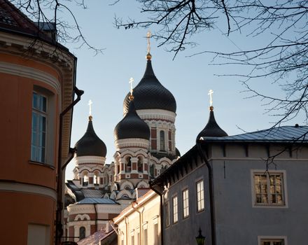 Greek Orthodox cathedral of Alexander Nevsky in Tallinn Estonia over the tops of old houses and the town wall