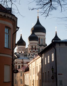 Greek Orthodox cathedral of Alexander Nevsky in Tallinn Estonia over the tops of old houses and the town wall