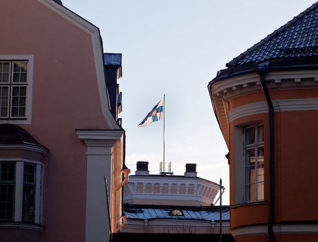 Estonian flag flies over the old buildings of Tallinn in the Toompea district