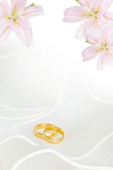 wedding invitation or greeting card blank with lily flowers and golden rings