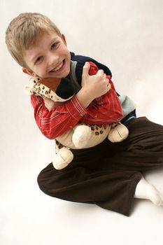 Young boy with toy plush