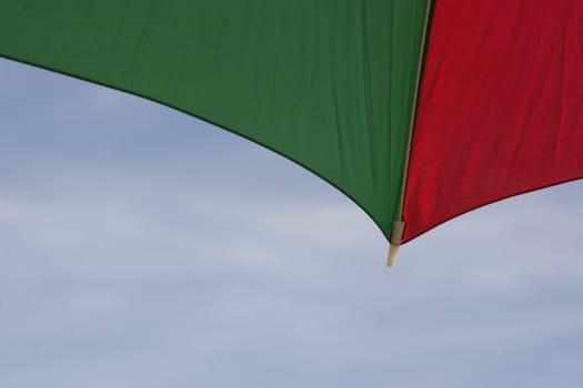 red and green parasol with copy space in the sky area