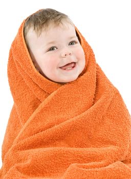 Child in orange towel. Joyful smile. Isolated.