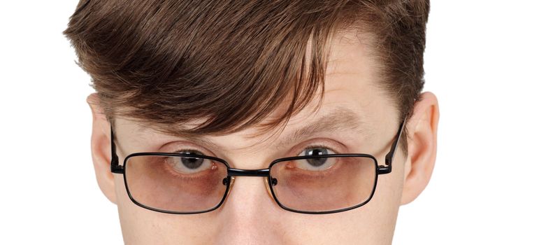 Eyes of the young man with glasses - close-up