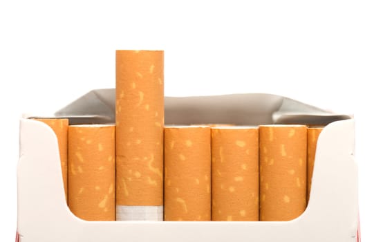 Open a pack of filtered cigarettes closeup isolated on a white background.