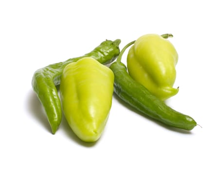 Hot and sweet green peppers isolated on white background.