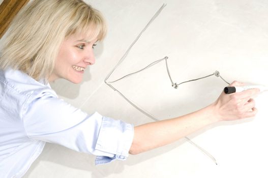 a woman at a white board presenting information