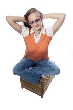 woman in casual dress sitting on a box