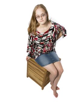 Young Model posing on a box in simple fashion