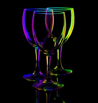 three empty wine glasses, isolated on black