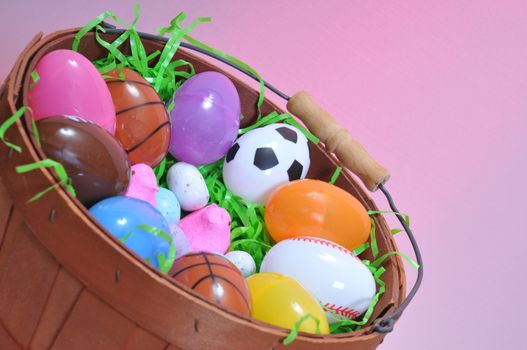 Basket of plastic eggs and candy for easter