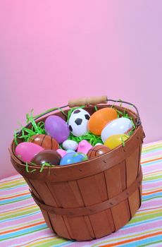 a small easter basket with candy and plastic eggs