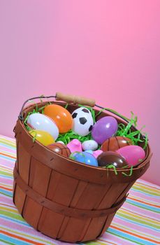 a basket of plastic eggs and candy for easter