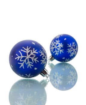 close-up christmas decorations with reflection, isolated on white