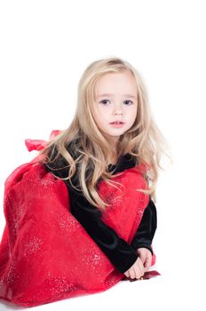 Beautiful baby girl dressed up for Christmas isolated in white