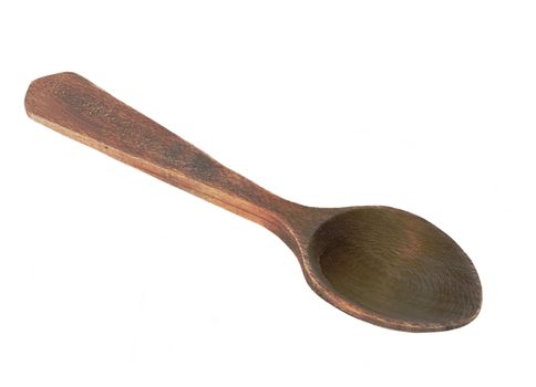 Wooden spoon on white background