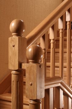 a wooden handrail of a ladder