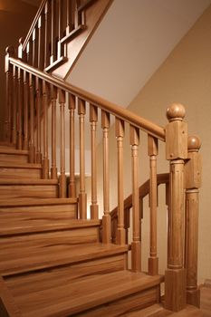 a wooden handrail of a ladder