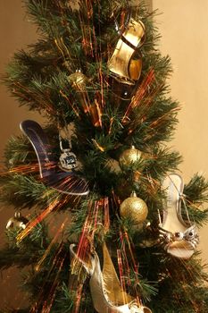 The Christmas fur-tree decorated with shoes