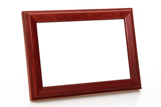 Wooden picture frame on bright background