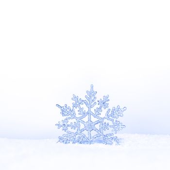 beautiful silver snowflake in snow