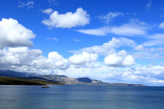 fishing boat under the blue sky